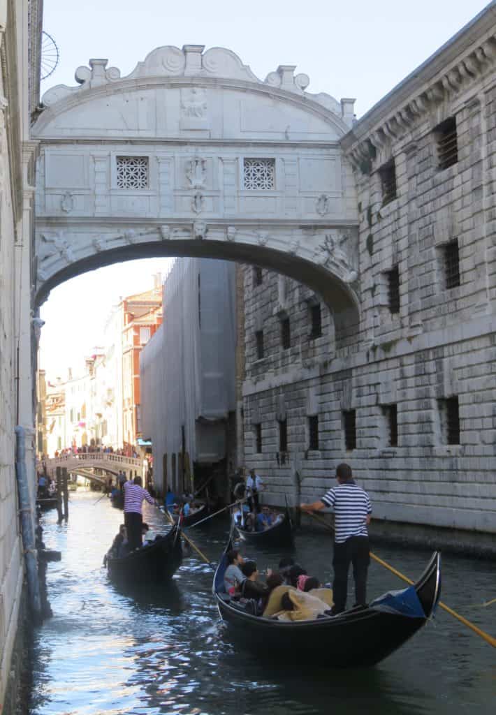 Gondoliers under the Bridge of Sighs in Venice