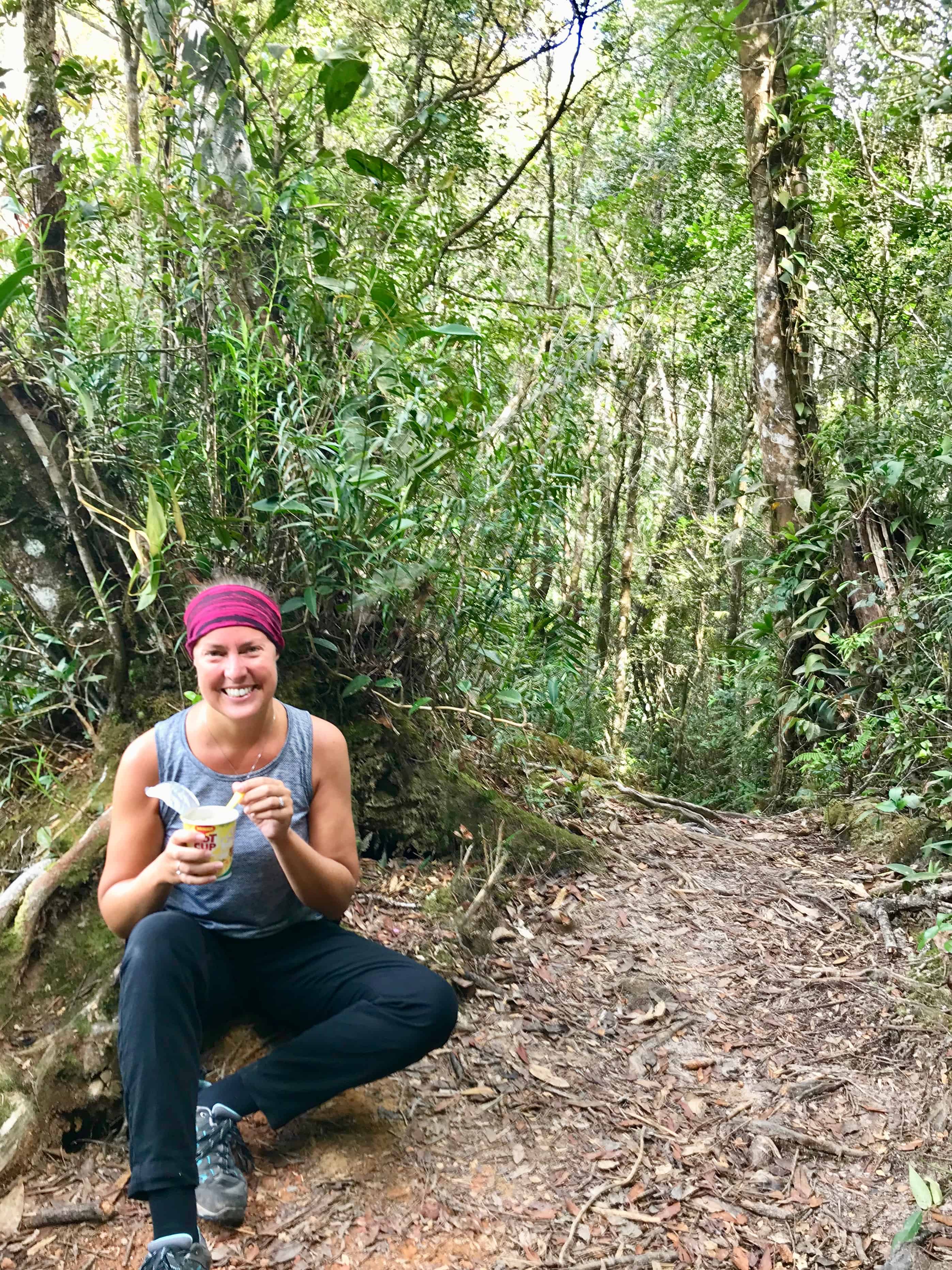 Enjoying a pot noodle lunch along Liwagu trail with views of mount Kinabalu