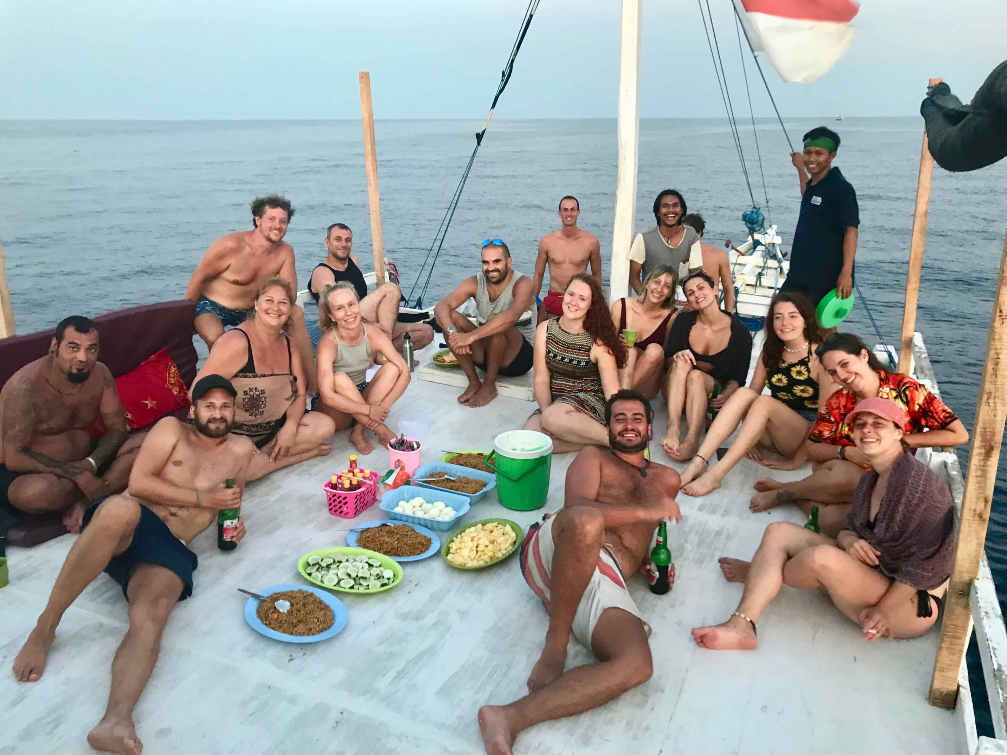 Group dinner on deck during our Komodo Island boat tour with Wanua Adventure