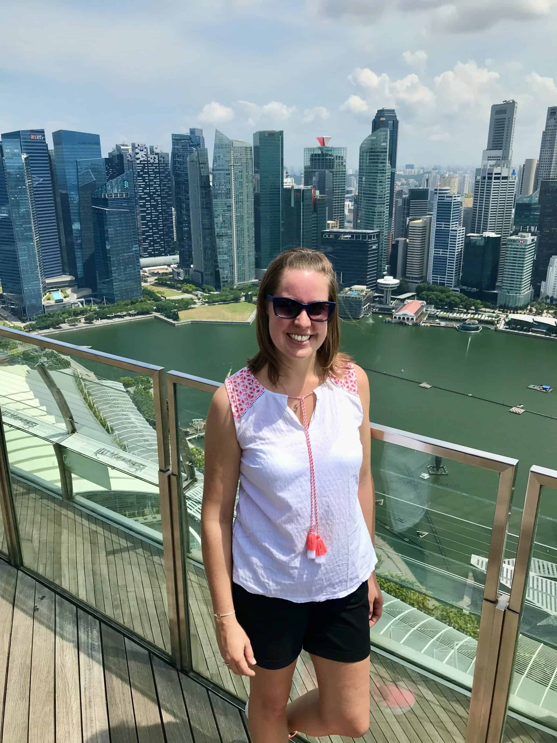 Joannda at the top of SkyPark Observatory with Singapore skyline in background