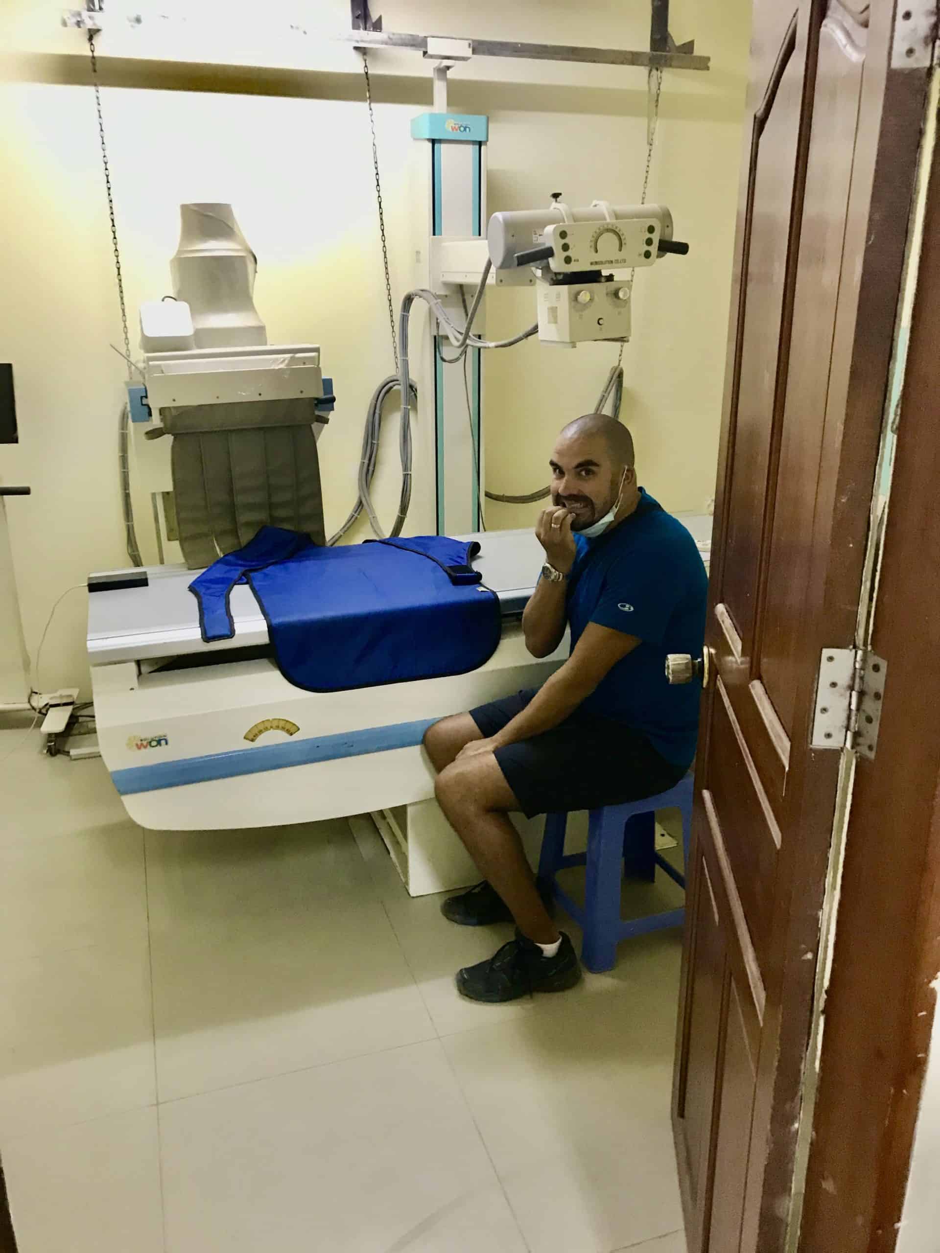 Omer waiting for an x-ray at a hospital in Cambodia